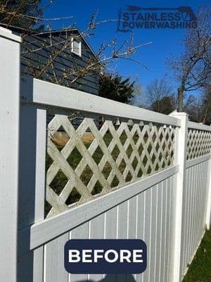 Before image of a white vinyl fence with lattice panels, showcasing dirt and wear.