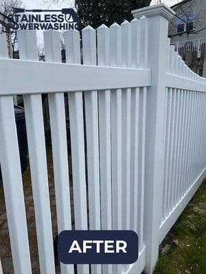 Clean white vinyl fence after power washing by Stainless Powerwashing. Enhanced curb appeal.